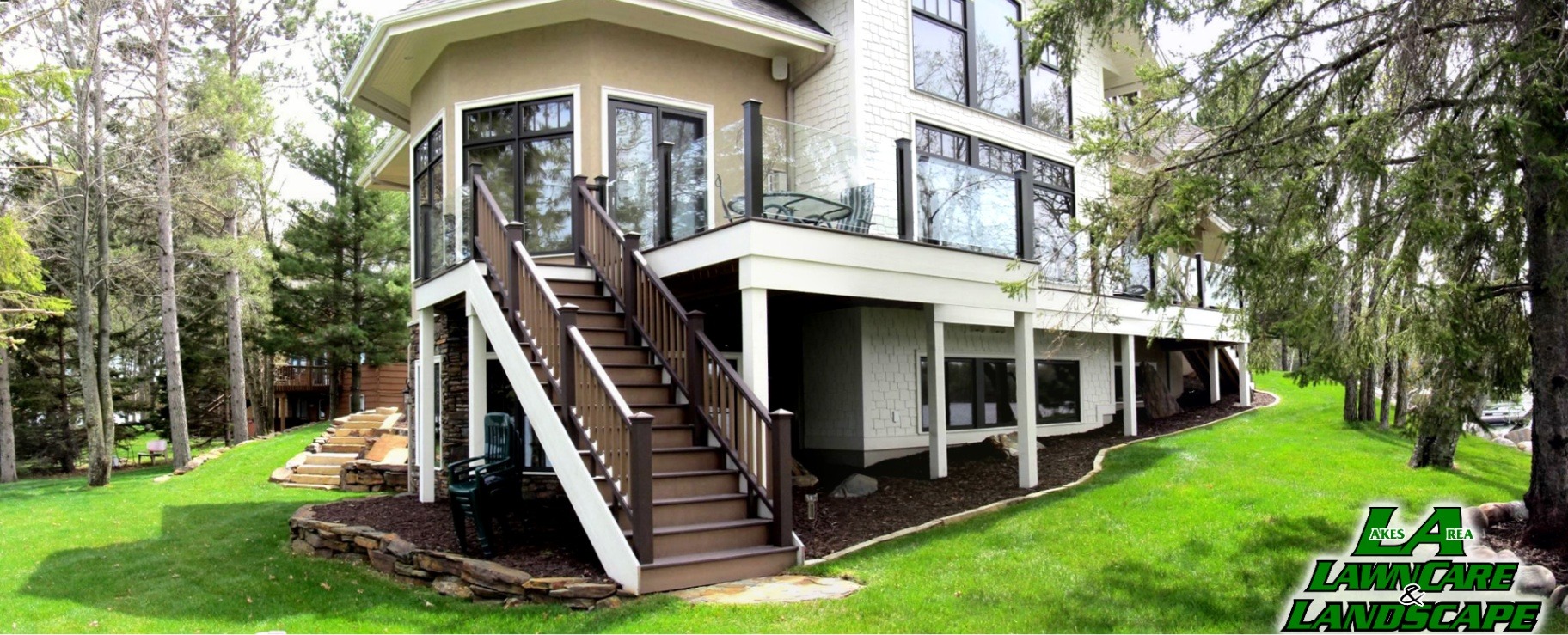 Gladwin residence lakeside home with deck and staircase